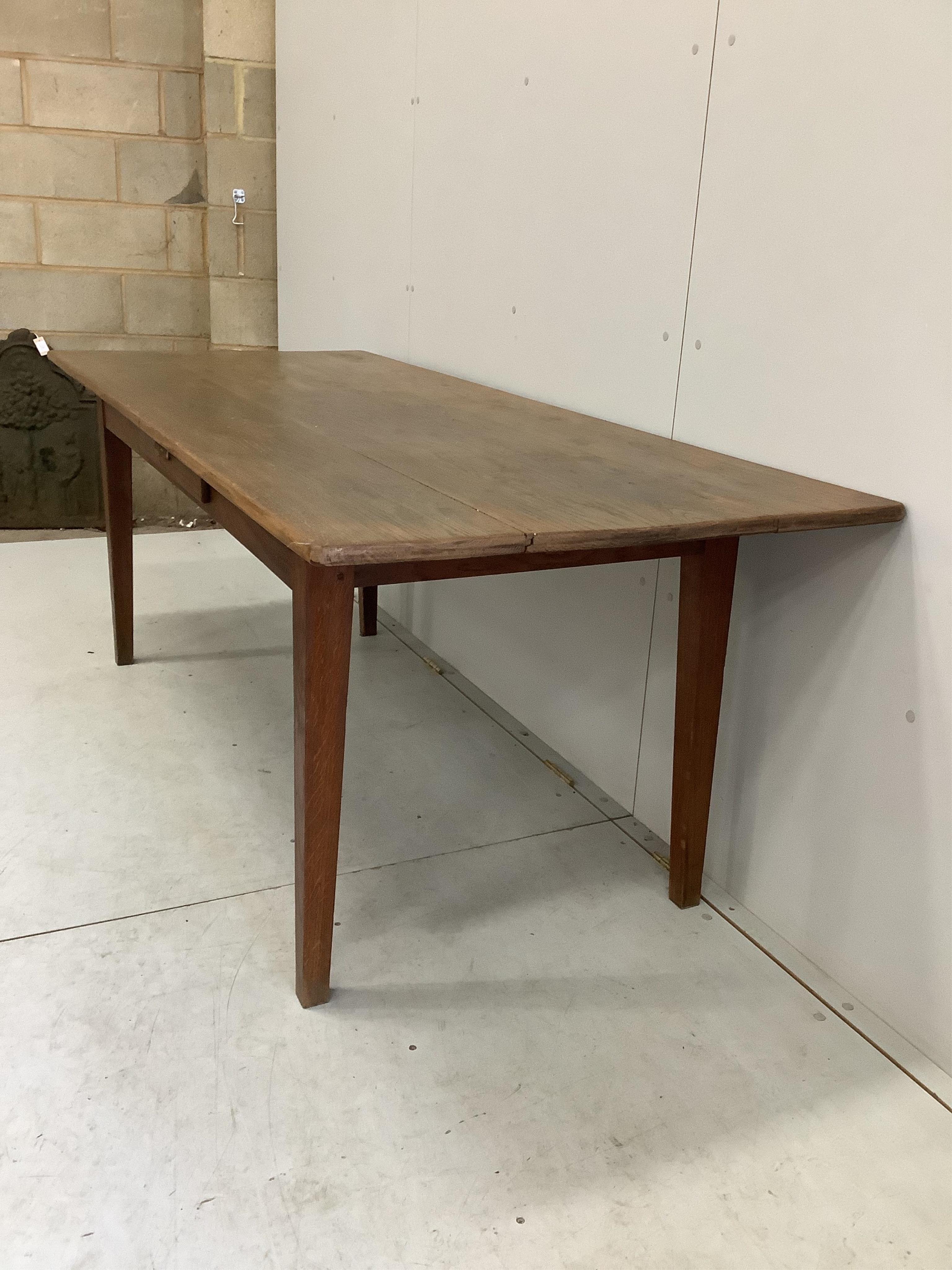 A 19th century French oak rectangular kitchen table, width 198cm, depth 82cm, height 73cm. Condition - fair